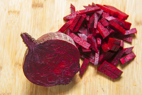 Beetroots chopped and placed on a table.