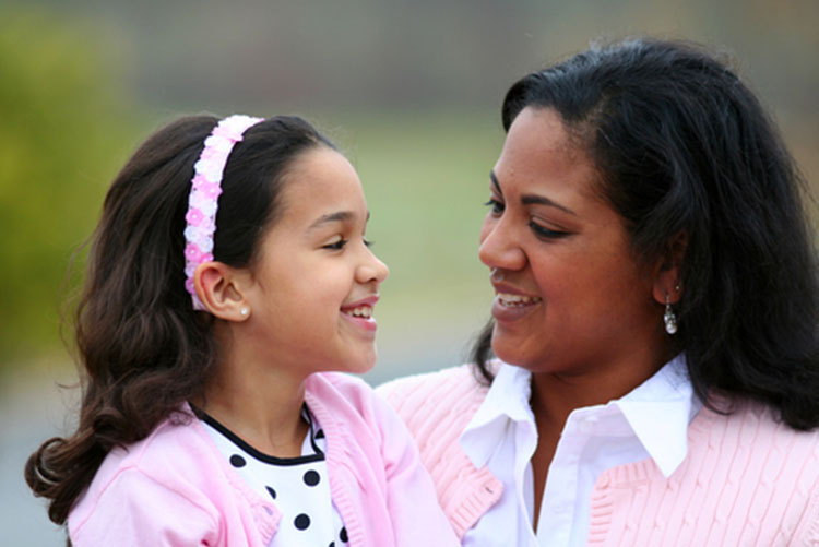 Mother and daughter smiling at each other!